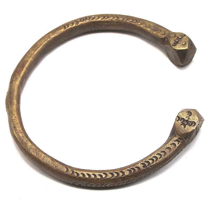 Lot 182 - A Persian white metal slave bangle, with
